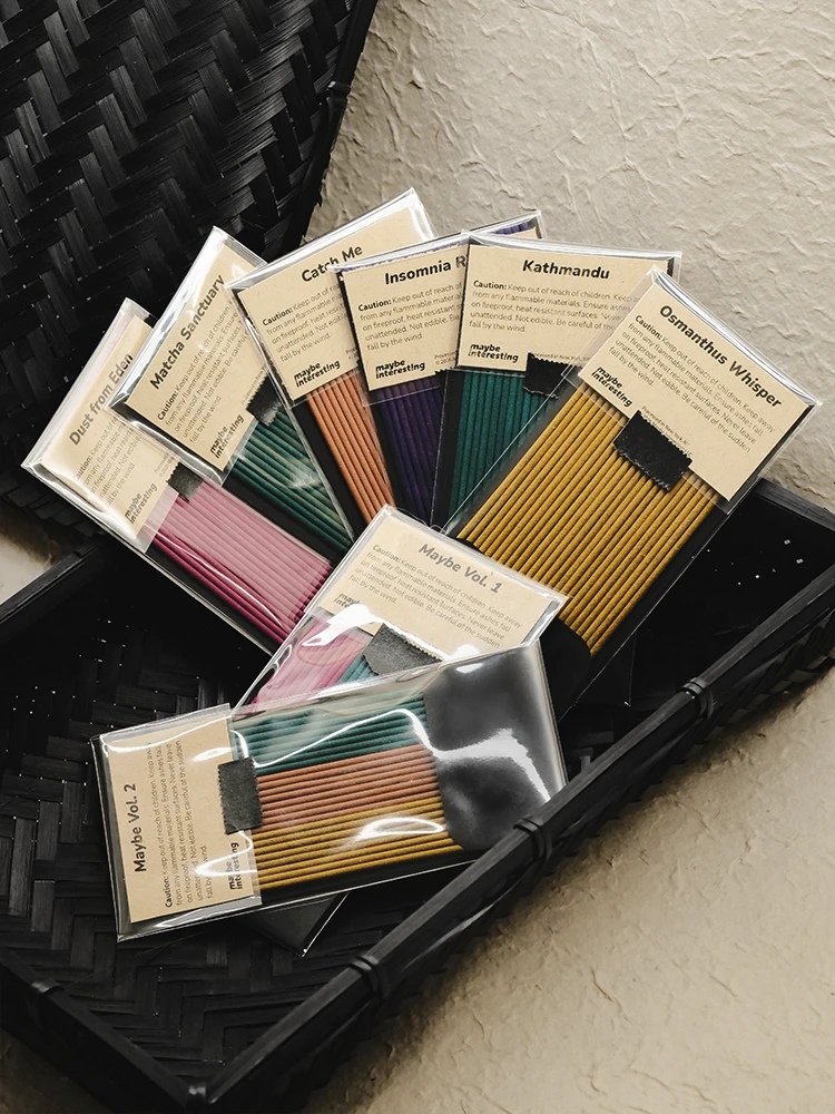 natural incense sticks grouped in woven bamboo case on organic paper