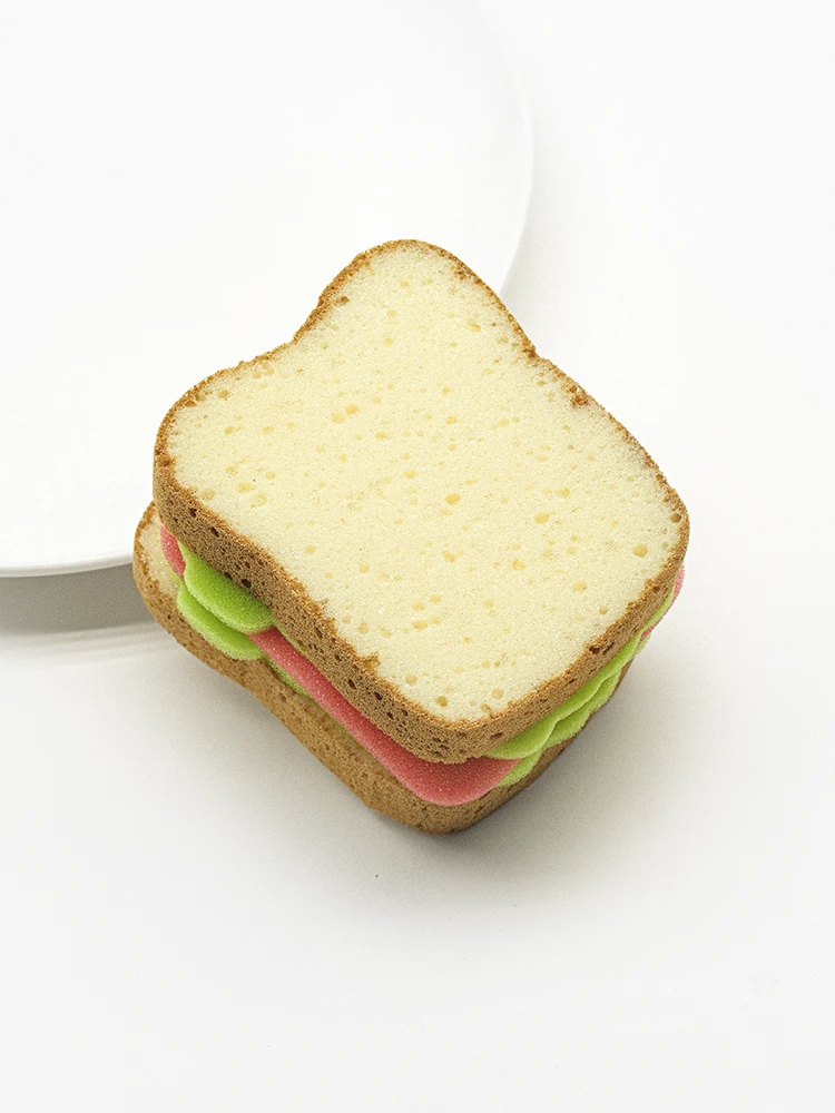 Layered sandwich style dishwashing sponge