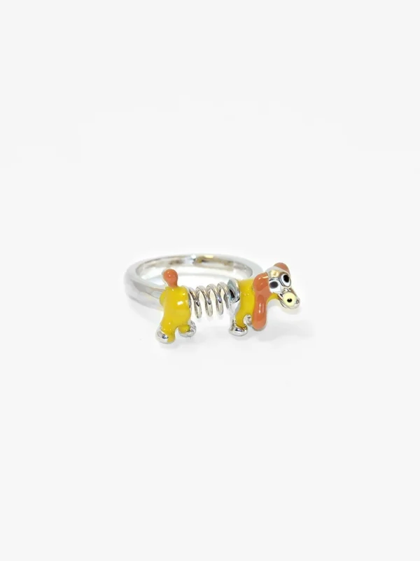 yellow resin slinky dog ring with glossy enamel finish on alloy band