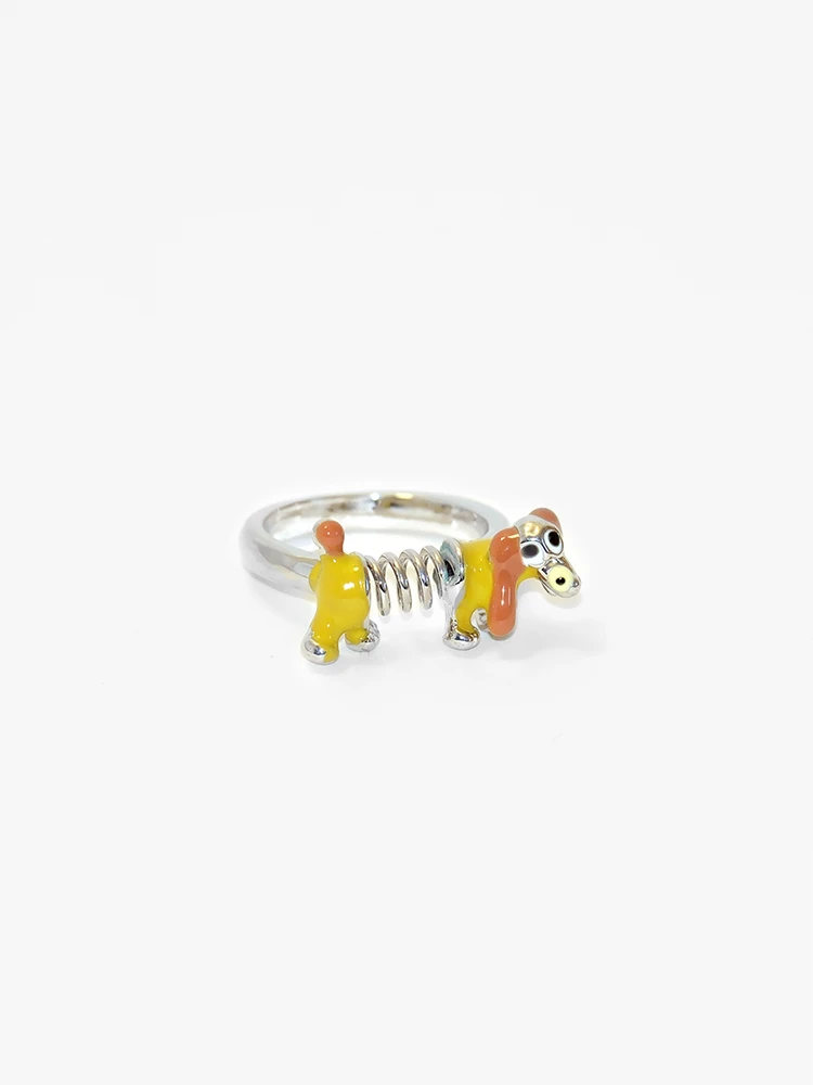 yellow resin slinky dog ring with glossy enamel finish on alloy band