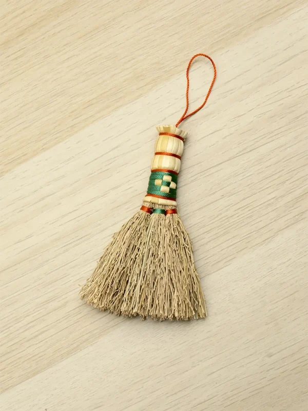 Tiny sorghum broom charm with green woven detail for bags and home decoration