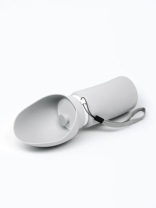 Gray collapsible silicone dog water bottle on white background