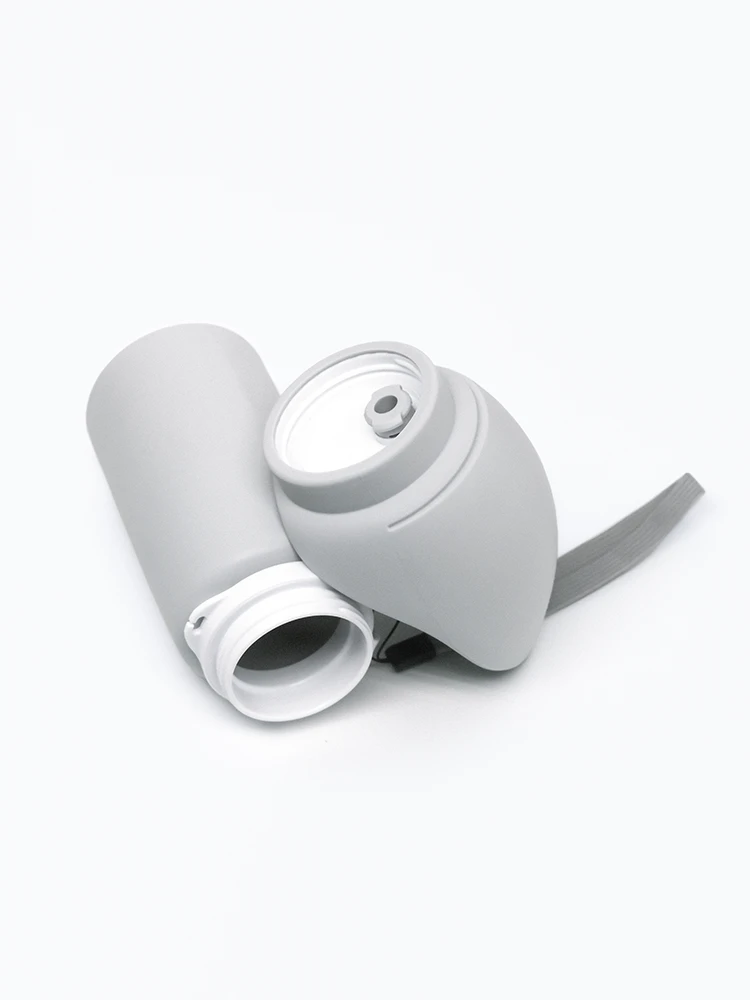 Gray portable dog water bottle with cap removed on white background