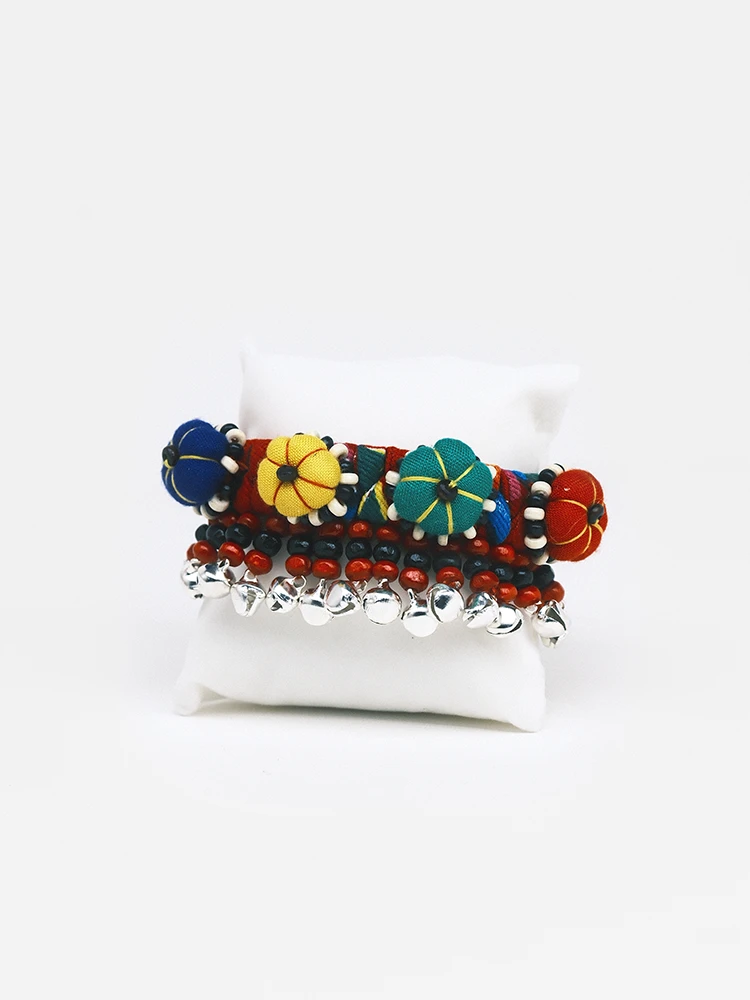Crimson multi-color tie dye fabric bracelet with pumpkin charms and bells