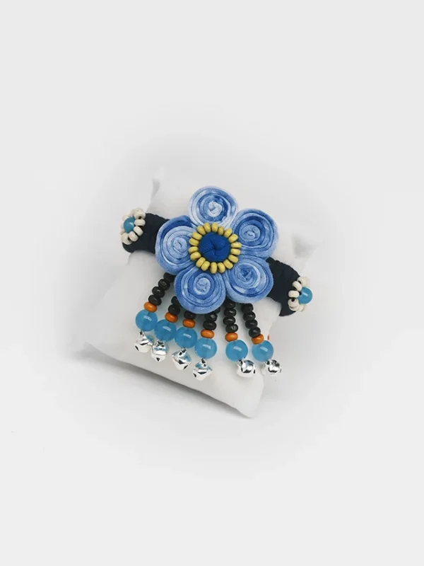 Indigo tie dye fabric bracelet with beaded flower and small ring bells