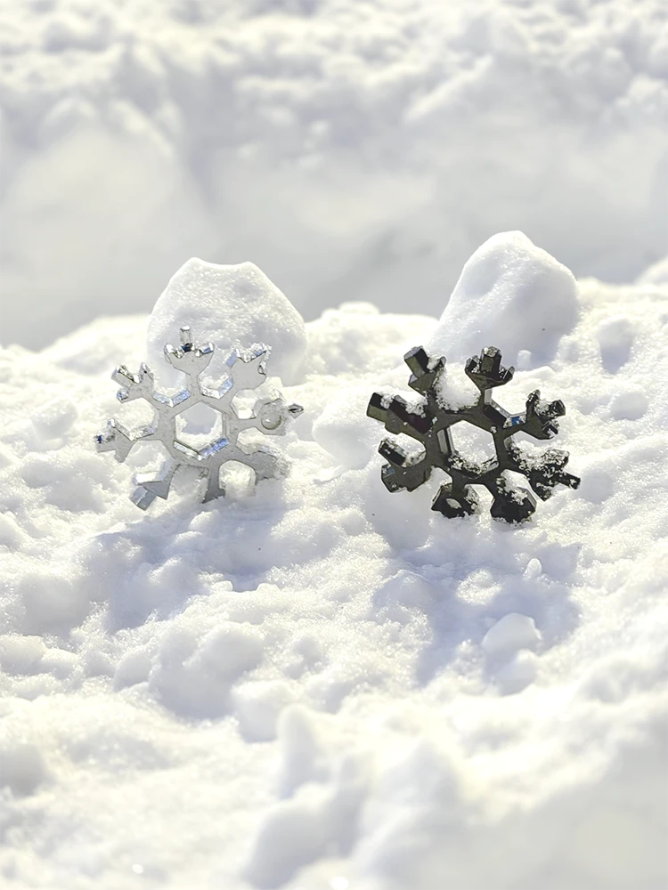 Snowflake multi tool silver and black in snow