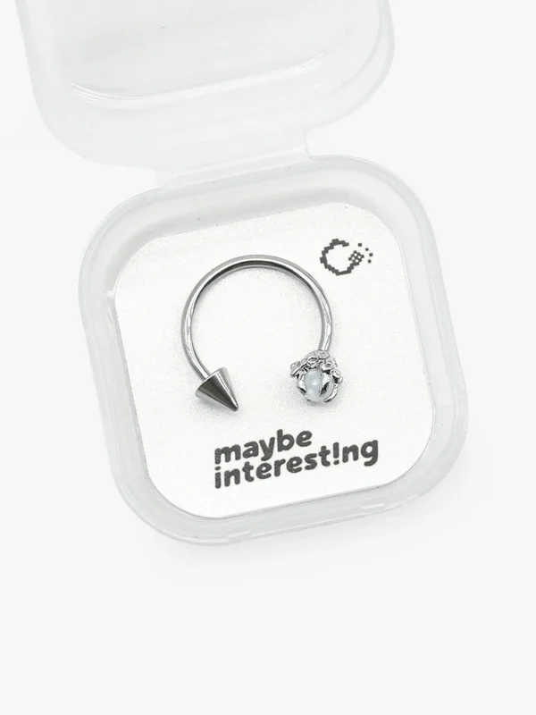 White resin crystal dragon claw lip ring on 8bit graphic card